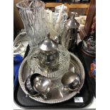 A tray containing a four piece silver plated tea service on circular tray,