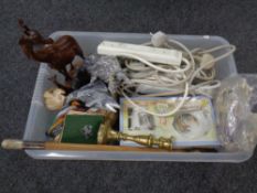 A box containing brass candlestick, riding crop, extension leads,