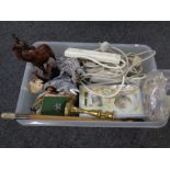 A box containing brass candlestick, riding crop, extension leads,