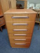 A 20th century teak G plan narrow six drawer chest