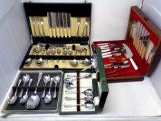 Four canteens and boxes containing assorted cutlery,
