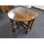 A Titchmarsh & Goodwin small oak drop leaf table retailed by Chapman's