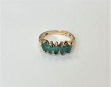 A 14ct gold emerald five stone ring, size M CONDITION REPORT: 2.
