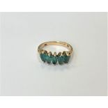 A 14ct gold emerald five stone ring, size M CONDITION REPORT: 2.