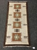 An Eastern flatweave kilim 63 cm x 128 cm