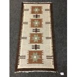 An Eastern flatweave kilim 63 cm x 128 cm