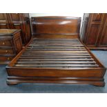 A mahogany effect 6' bed frame