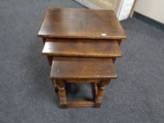 An oak Titchmarsh & Goodwin nest of three tables retailed by Chapman's