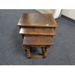 An oak Titchmarsh & Goodwin nest of three tables retailed by Chapman's