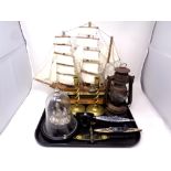 A tray containing antique oil lamp, three diecast models of a spitfire, the Bismarck and HMS Hood,