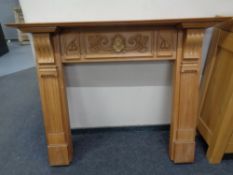 A Victorian style pine fire surround