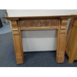 A Victorian style pine fire surround