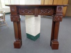 A Victorian style fire surround in a mahogany finish