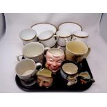 A tray containing assorted character jugs, Arthur Wood tankard, commemorative tankard,