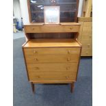 A mid 20th century teak vanity chest