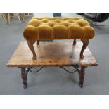 A rustic pine refectory coffee table together with a dralon upholstered footstool