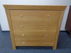 A contemporary oak four drawer chest