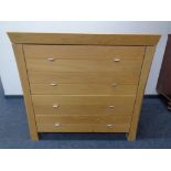 A contemporary oak four drawer chest