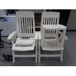 A pair of Hartman white plastic folding reclining armchairs,