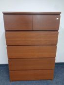 A teak effect six drawer chest