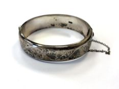 An engraved silver bangle CONDITION REPORT: 24.