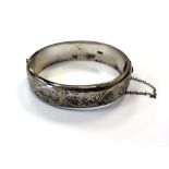 An engraved silver bangle CONDITION REPORT: 24.