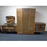 A mid 20th century teak effect four piece bedroom suite