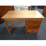 A 20th century teak single pedestal desk