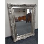 A contemporary silvered overmantel mirror