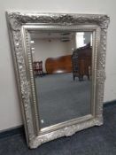 A contemporary silvered overmantel mirror