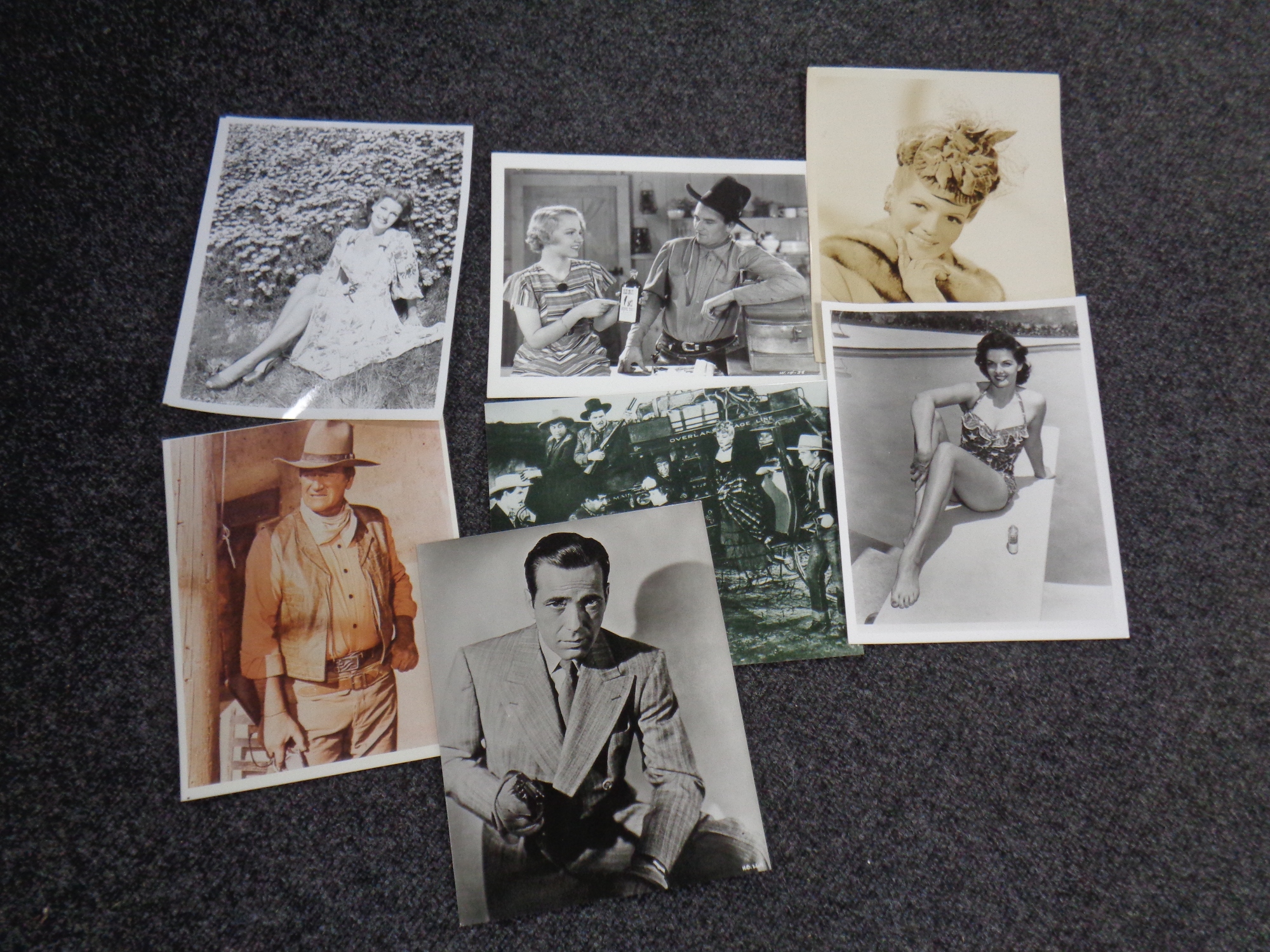 Press photographs of John Wayne, Rita Hayworth, Jane Russell and Humphrey Bogart.