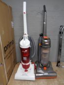 Two upright vacuums by Vax and Hoover