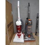 Two upright vacuums by Vax and Hoover