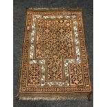 An Afghan prayer rug 89 cm x 130 cm