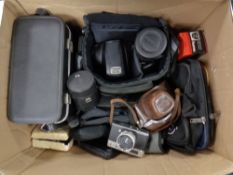 A box containing a quantity of assorted cameras,