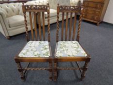 A pair of beech barley twist chairs