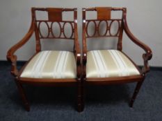 A pair of reproduction mahogany carver armchairs