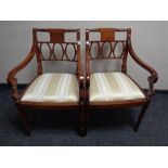 A pair of reproduction mahogany carver armchairs