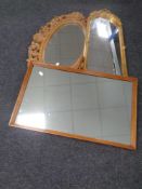 A carved wooden oval mirror,