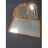 A carved wooden oval mirror,