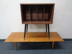 A mid 20th century teak record cabinet on raised legs together with a further coffee table