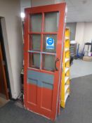 A pair of Edwardian painted interior vestibule doors with glass inset panels, height 212 cm.