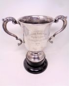 A silver twin handled trophy cup engraved Empire Ball room, Chester Le Street, Challenge Cup 1934,