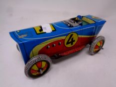 A tin plate wind up racing car