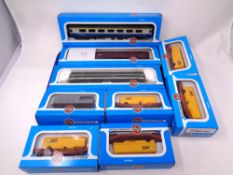 A tray containing Airfix 00 gauge railway carriages and wagons (boxed)