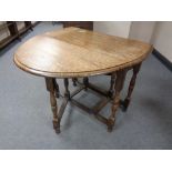 An Edwardian oak gateleg table