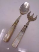 A mother of pearl handled spoon and fork