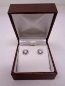 A pair of silver cubic zirconia cluster earrings