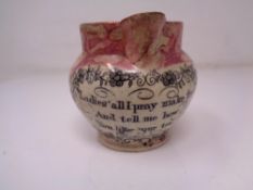 An early 19th century Sunderland lustre motto milk jug