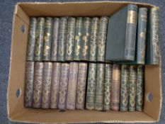 A box containing 31 twentieth century volumes with gilded spines, Thackeray, Dickens,